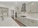 Modern kitchen features white countertops, stainless steel appliances and eat-in bar at 304 O'Malley Dr, Summerville, SC 29483