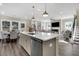 Spacious kitchen featuring an island, stainless steel appliances, and an adjacent dining area at 304 O'Malley Dr, Summerville, SC 29483