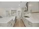 This kitchen features white countertops, stainless steel appliances, and an eat-in bar at 304 O'Malley Dr, Summerville, SC 29483