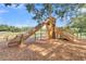 Community playground featuring a tower with slide and climbing structure in mulch at 304 O'Malley Dr, Summerville, SC 29483