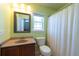 Bathroom has a vanity with a sink, toilet and a shower/tub with a curtain at 309 Peters Creek Dr, Summerville, SC 29486