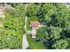 Birds-eye view of a quaint home with a well-manicured lawn, surrounded by lush trees for privacy at 317 Lankford St, Moncks Corner, SC 29461