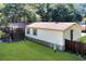Backyard of home featuring a porch, a well-maintained lawn, and a wooden fence at 317 Lankford St, Moncks Corner, SC 29461