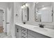 A modern bathroom features dual sinks, gray cabinetry, modern fixtures, and a separate marble tiled shower at 324 Abercom Place Dr, Moncks Corner, SC 29461