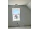 A bedroom features gray walls, a window, and a sloped ceiling at 324 Abercom Place Dr, Moncks Corner, SC 29461