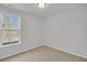 Bedroom featuring neutral carpeting, light gray walls, and a large window at 324 Abercom Place Dr, Moncks Corner, SC 29461