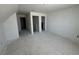 A bonus room features white walls, gray floors, and three doorways at 324 Abercom Place Dr, Moncks Corner, SC 29461