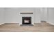 Fireplace features a modern hearth, wooden mantle, and light gray walls at 324 Abercom Place Dr, Moncks Corner, SC 29461