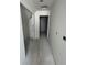 A hallway features gray walls, grey floors, and a doorway at 324 Abercom Place Dr, Moncks Corner, SC 29461