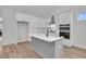 Kitchen featuring modern appliances, granite countertops, an island, and plenty of cabinets at 324 Abercom Place Dr, Moncks Corner, SC 29461