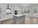 Kitchen featuring modern appliances, granite countertops, an island, and plenty of cabinets at 324 Abercom Place Dr, Moncks Corner, SC 29461