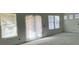 Bright living room featuring multiple windows and a sliding glass door at 324 Abercom Place Dr, Moncks Corner, SC 29461