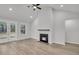 Living room features a fireplace, ceiling fan, and beautiful french doors leading outside at 324 Abercom Place Dr, Moncks Corner, SC 29461