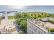 Stunning aerial view of a rooftop terrace with harbor views, lounge seating, and lush greenery at 32-E Prioleau St, Charleston, SC 29401