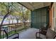 Relaxing balcony with black metal railing offering peaceful park and waterfront views at 32-E Prioleau St, Charleston, SC 29401