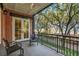 Charming balcony with views of lush greenery through French doors at 32-E Prioleau St, Charleston, SC 29401