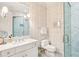 Elegant bathroom featuring patterned wallpaper, marble floors, and glass shower at 32-E Prioleau St, Charleston, SC 29401