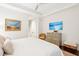 Well-lit bedroom featuring stylish furniture, artwork, and a comfortable seating area at 32-E Prioleau St, Charleston, SC 29401