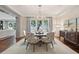 Bright dining room with hardwood floors, a chandelier and a water view at 32-E Prioleau St, Charleston, SC 29401
