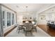 Dining room featuring hardwood floors, a chandelier and views into an open-concept kitchen at 32-E Prioleau St, Charleston, SC 29401