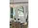 Bright dining room looking out of the large windows with an outside view at 32-E Prioleau St, Charleston, SC 29401