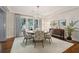 Dining room featuring hardwood floors, a chandelier and a large area rug at 32-E Prioleau St, Charleston, SC 29401