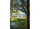 Exterior view of a water fountain surrounded by lush greenery and mature trees at 32-E Prioleau St, Charleston, SC 29401