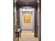 Elegant hallway with decorative wall trim and globe chandelier for a luxury feel at 32-E Prioleau St, Charleston, SC 29401