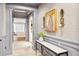 Elegant hallway featuring detailed molding, contemporary artwork, and stylish console table at 32-E Prioleau St, Charleston, SC 29401