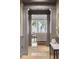 Hallway with gray trim and view into living room at 32-E Prioleau St, Charleston, SC 29401