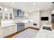 Well-appointed kitchen with custom cabinets, marble countertops and state-of-the-art appliances at 32-E Prioleau St, Charleston, SC 29401