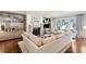 Bright living room features a fireplace, large windows and comfortable seating at 32-E Prioleau St, Charleston, SC 29401