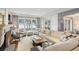 Bright living room features a fireplace, large windows and comfortable seating at 32-E Prioleau St, Charleston, SC 29401