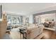 Bright living room features a fireplace, large windows and comfortable seating and dining room at 32-E Prioleau St, Charleston, SC 29401