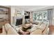 Bright living room features a fireplace, large windows and comfortable seating at 32-E Prioleau St, Charleston, SC 29401
