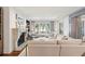 Bright living room features a fireplace, large windows and comfortable seating at 32-E Prioleau St, Charleston, SC 29401