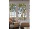 Bright living room seating area looking out of the large windows with an outside view at 32-E Prioleau St, Charleston, SC 29401