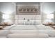 Close up of the bed in this luxury bedroom with lamps on bedside tables at 32-E Prioleau St, Charleston, SC 29401