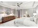 Spacious main bedroom featuring four-poster bed, desk, and dresser for ample storage at 32-E Prioleau St, Charleston, SC 29401