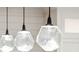 Modern kitchen pendant lighting with clear, geometric shades and dark hardware at 32-E Prioleau St, Charleston, SC 29401