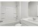 Clean bathroom features a tub with shower and a vanity with a sink and toilet at 332 Dickerson Ln, Lincolnville, SC 29485