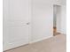 Interior with doors that enter in to other rooms with neutral paint and carpet at 332 Dickerson Ln, Lincolnville, SC 29485