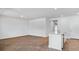 Open concept living room with wood floors and a kitchen with granite countertops at 332 Dickerson Ln, Lincolnville, SC 29485