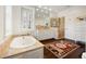 Bathroom featuring a soaking tub, glass shower, double vanity, and decorative tile floor at 35 Tradd St, Charleston, SC 29401