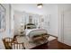 Bedroom featuring a large bed, natural lighting, and hardwood flooring at 35 Tradd St, Charleston, SC 29401