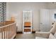 Bedroom featuring a crib, and doorway leading to the next room at 35 Tradd St, Charleston, SC 29401