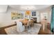 Spacious dining room with hardwood floors, a fireplace, and decorative lighting at 35 Tradd St, Charleston, SC 29401