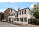 Charming two-story Charleston home featuring black shutters and a small balcony, creating a timeless aesthetic at 35 Tradd St, Charleston, SC 29401