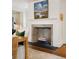 Dining room fireplace with white mantle and decorative painting above at 35 Tradd St, Charleston, SC 29401