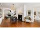 Elegant entryway showcasing hardwood floors, fireplace, and open access to adjoining living spaces at 35 Tradd St, Charleston, SC 29401